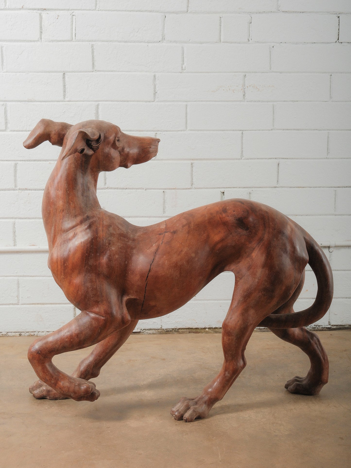 Hand-Carved Wooden Dog Sculpture in Dynamic Running Pose