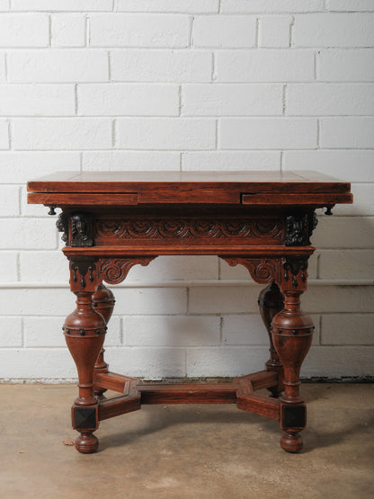 Antique Renaissance Revival Extendable Oak Table with Carved Masks and Ornate Detailing