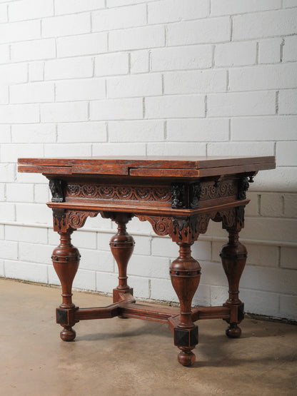 Antique Renaissance Revival Extendable Oak Table with Carved Masks and Ornate Detailing