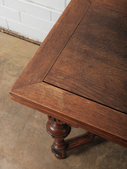 Antique Renaissance Revival Extendable Oak Table with Carved Masks and Ornate Detailing