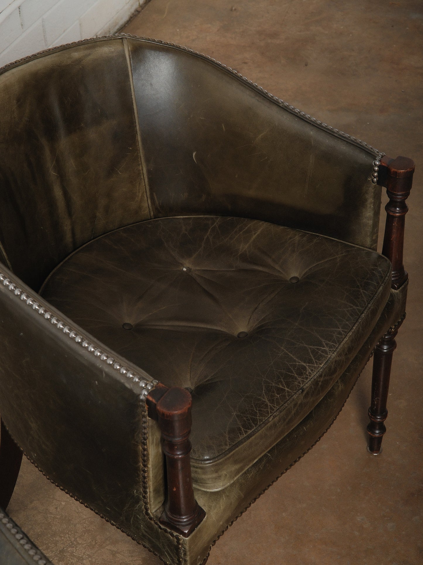 Pair of Vintage Green Leather Barrel Chairs with Turned Wood Legs and Nailhead Trim