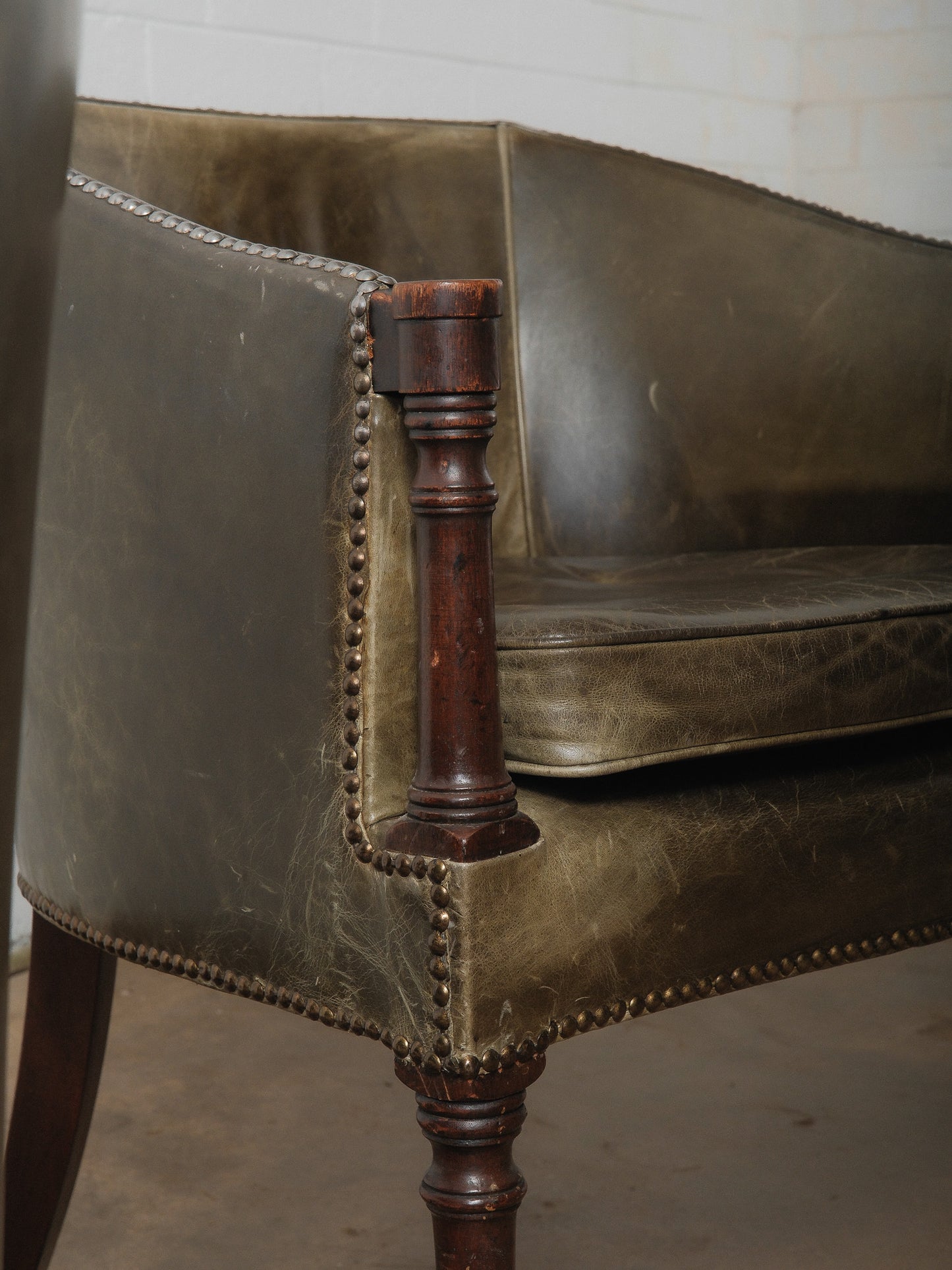 Pair of Vintage Green Leather Barrel Chairs with Turned Wood Legs and Nailhead Trim
