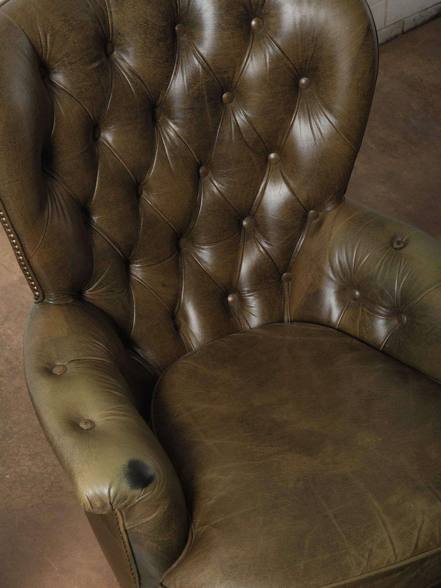 Pair of Vintage Tufted Leather Club Chairs with Brass Casters and Turned Legs