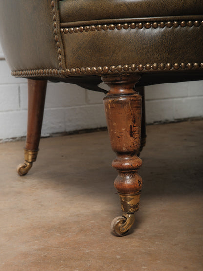 Pair of Vintage Tufted Leather Club Chairs with Brass Casters and Turned Legs