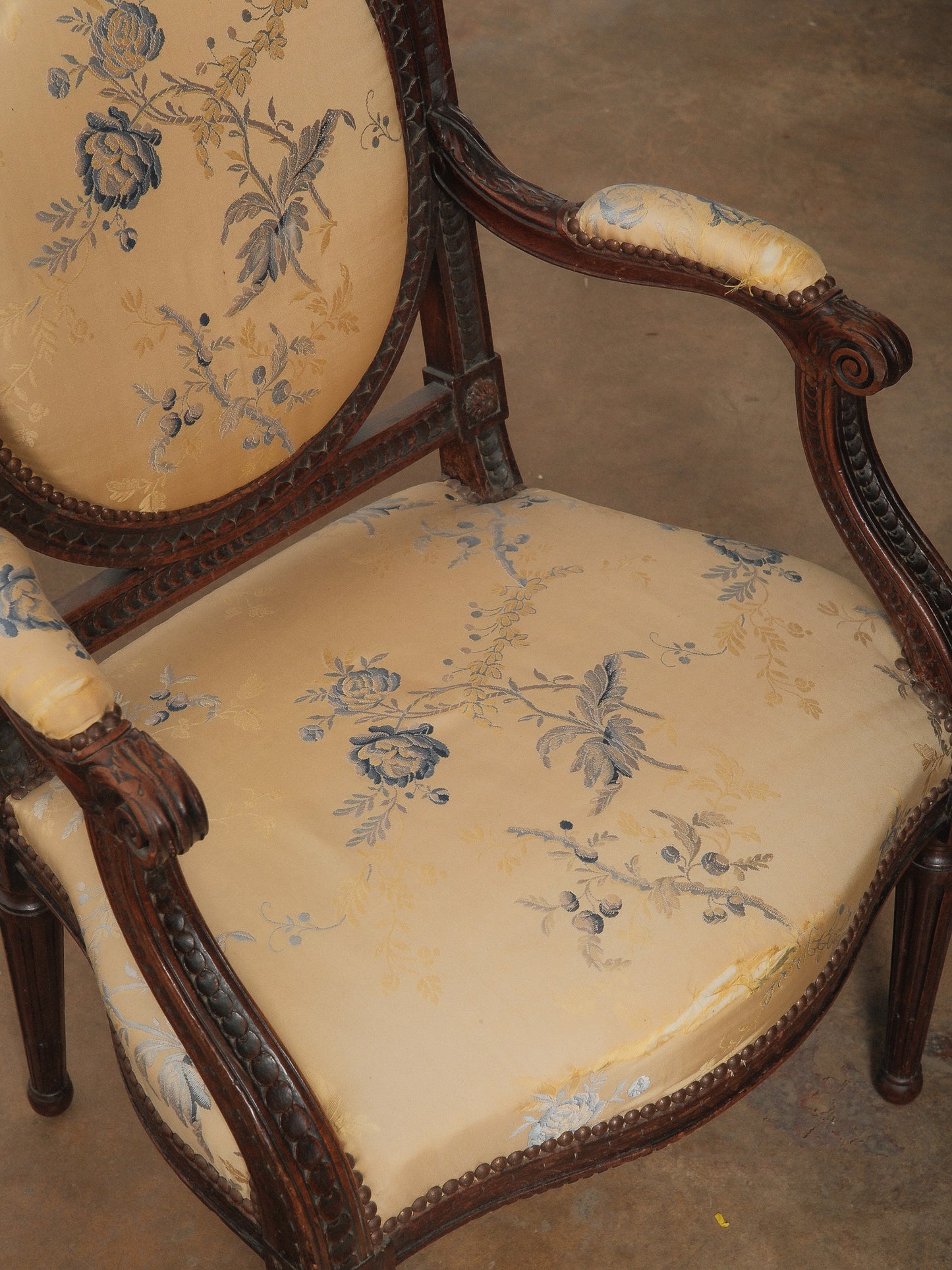 Pair of Antique Louis XVI Style Carved Armchairs with Floral Upholstery
