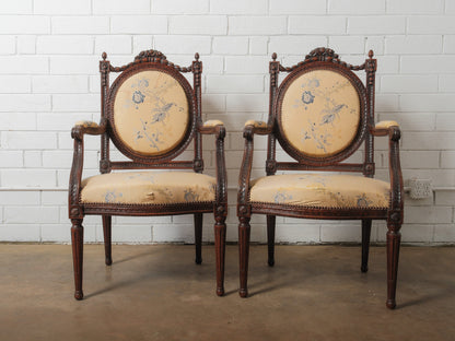 Pair of Antique Louis XVI Style Carved Armchairs with Floral Upholstery