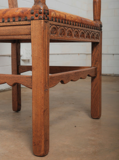 Antique Oak and Leather Armchair with Decorative Carving and Brass Nailhead Trim