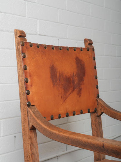 Antique Oak and Leather Armchair with Decorative Carving and Brass Nailhead Trim