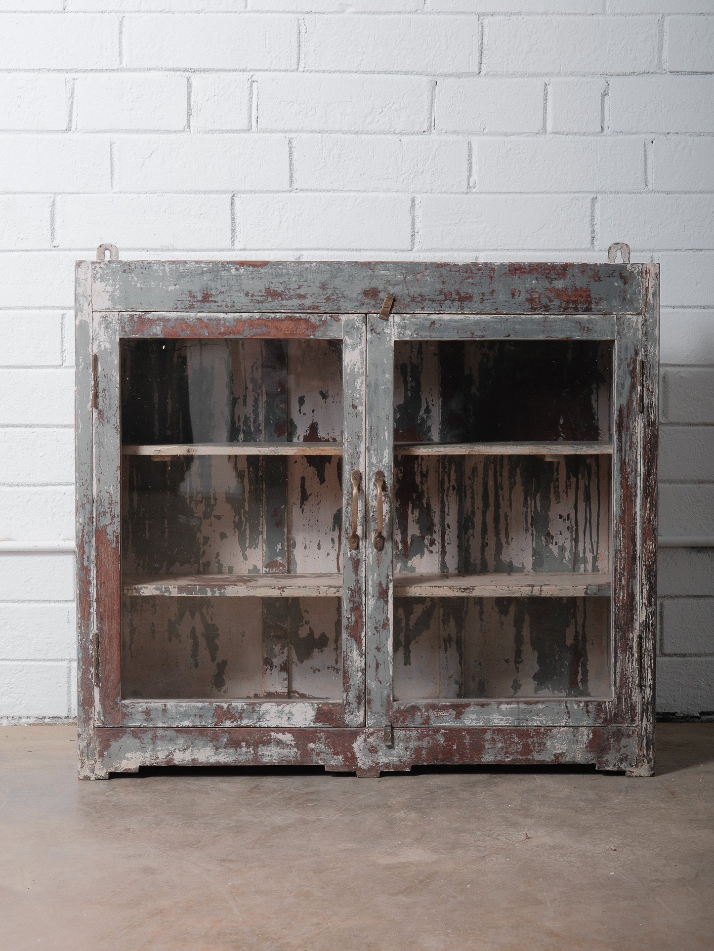 Rustic Glass-Front Cabinet With Distressed Paint