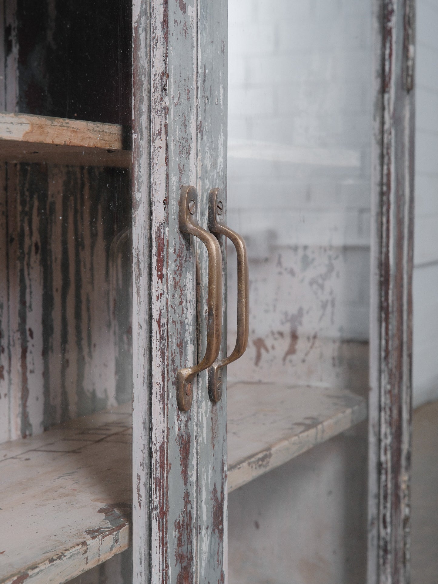 Rustic Glass-Front Cabinet With Distressed Paint