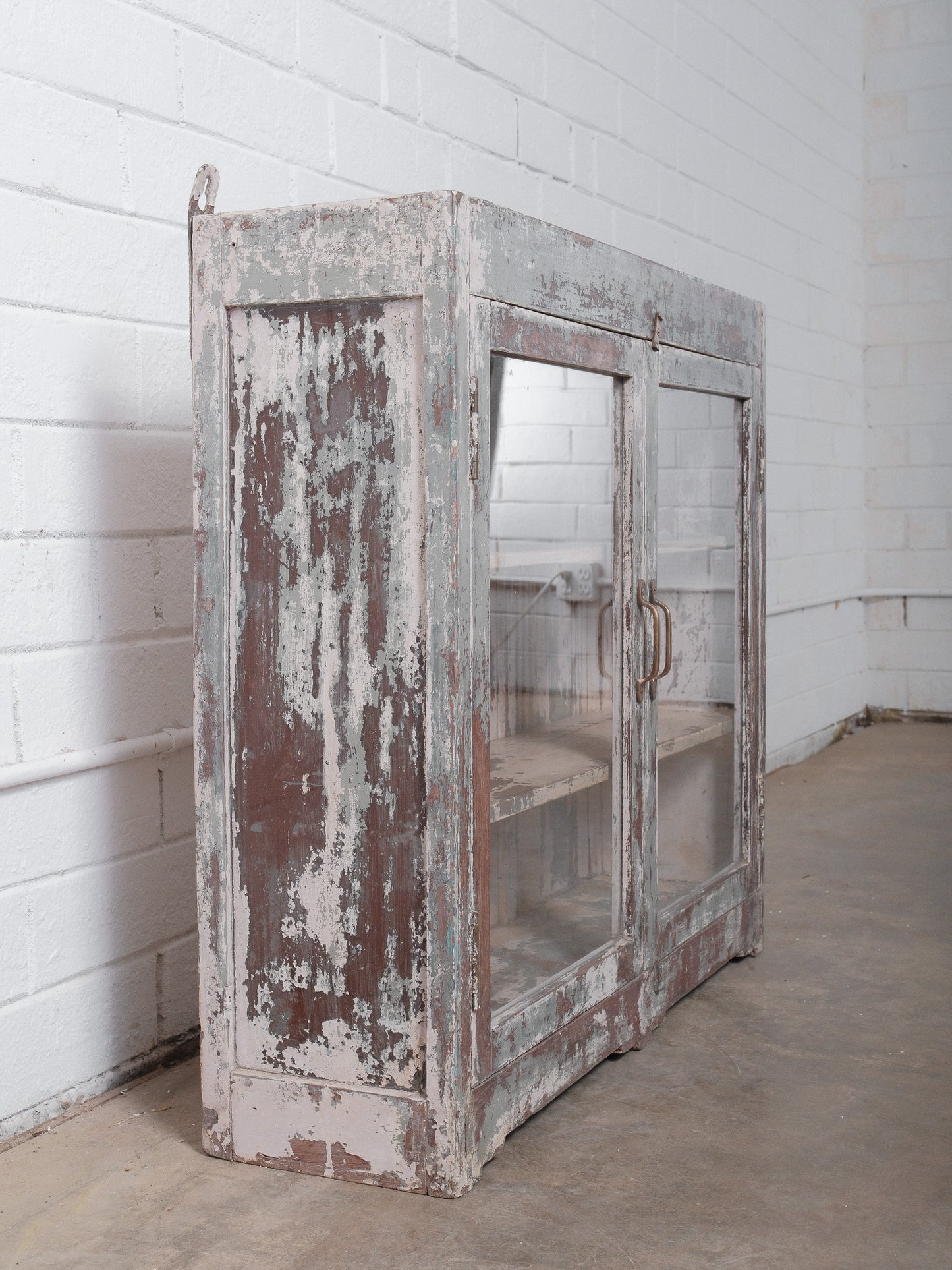Rustic Glass-Front Cabinet With Distressed Paint