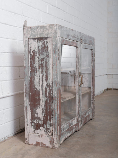 Rustic Glass-Front Cabinet With Distressed Paint