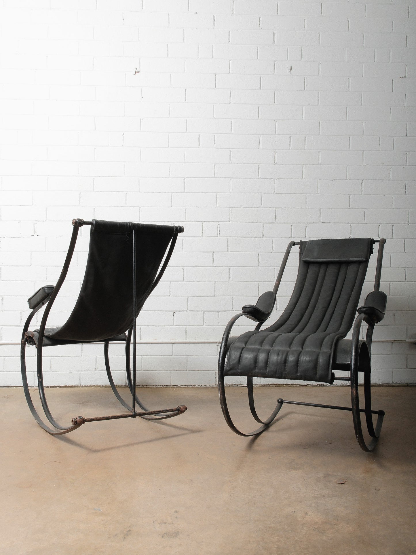Pair of Circa 1850 Peter Cooper Rocking Chairs for R.W. Winfield in Black Leather and Iron