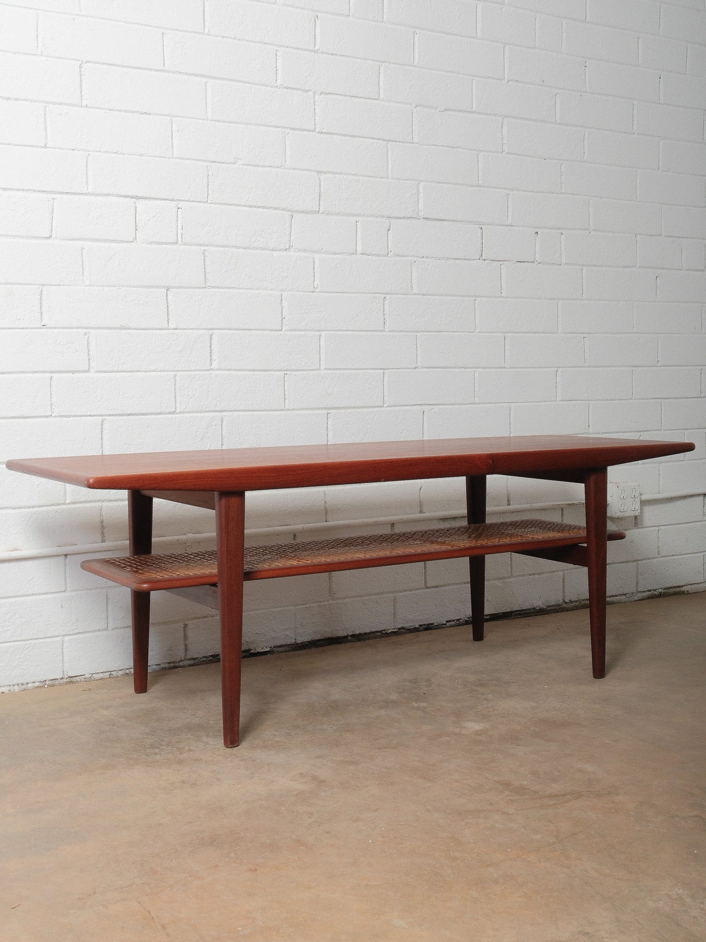 Danish Teak Coffee Table with Cane Shelf by Niels Bach, 1960s