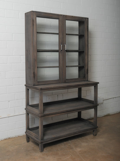 Dark Wood Glass-Front Cabinet on Tiered Open Base
