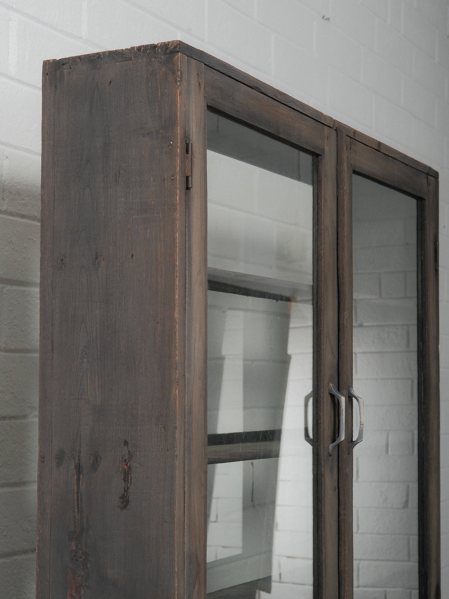 Dark Wood Glass-Front Cabinet on Tiered Open Base