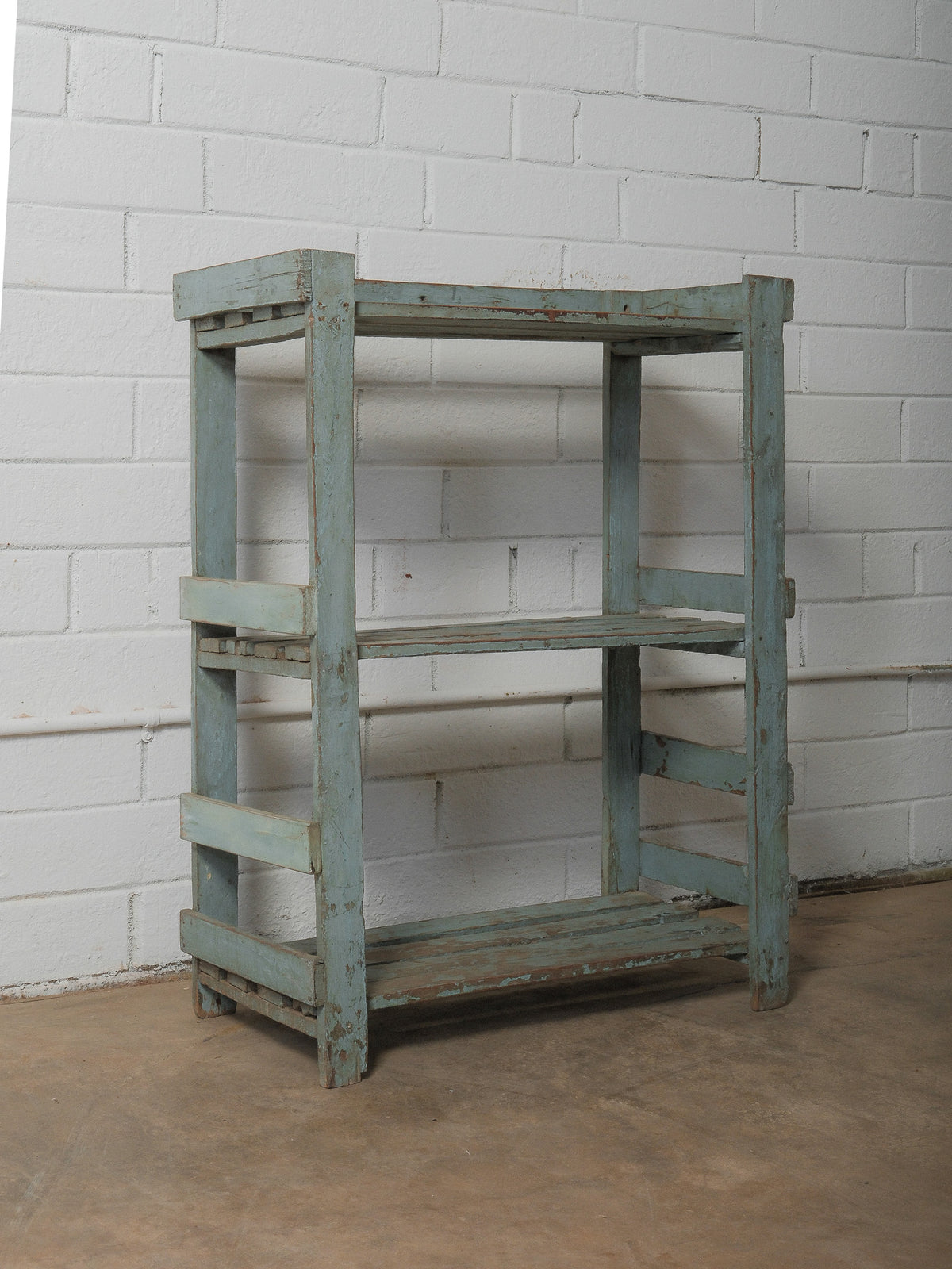 Weathered Blue Wooden Shelf with Open Framework