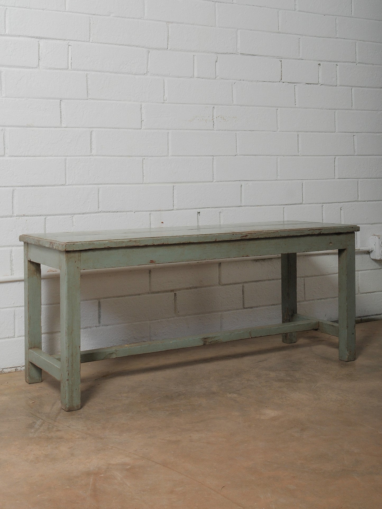 Distressed Green Wooden Bench with Weathered Patina