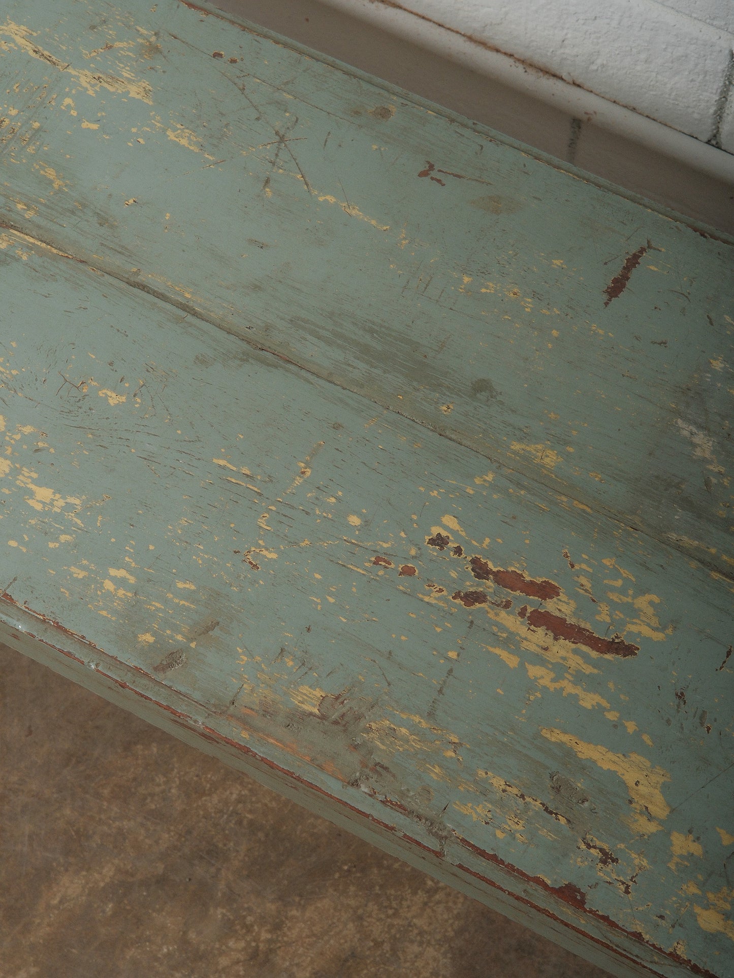 Distressed Green Wooden Bench with Weathered Patina