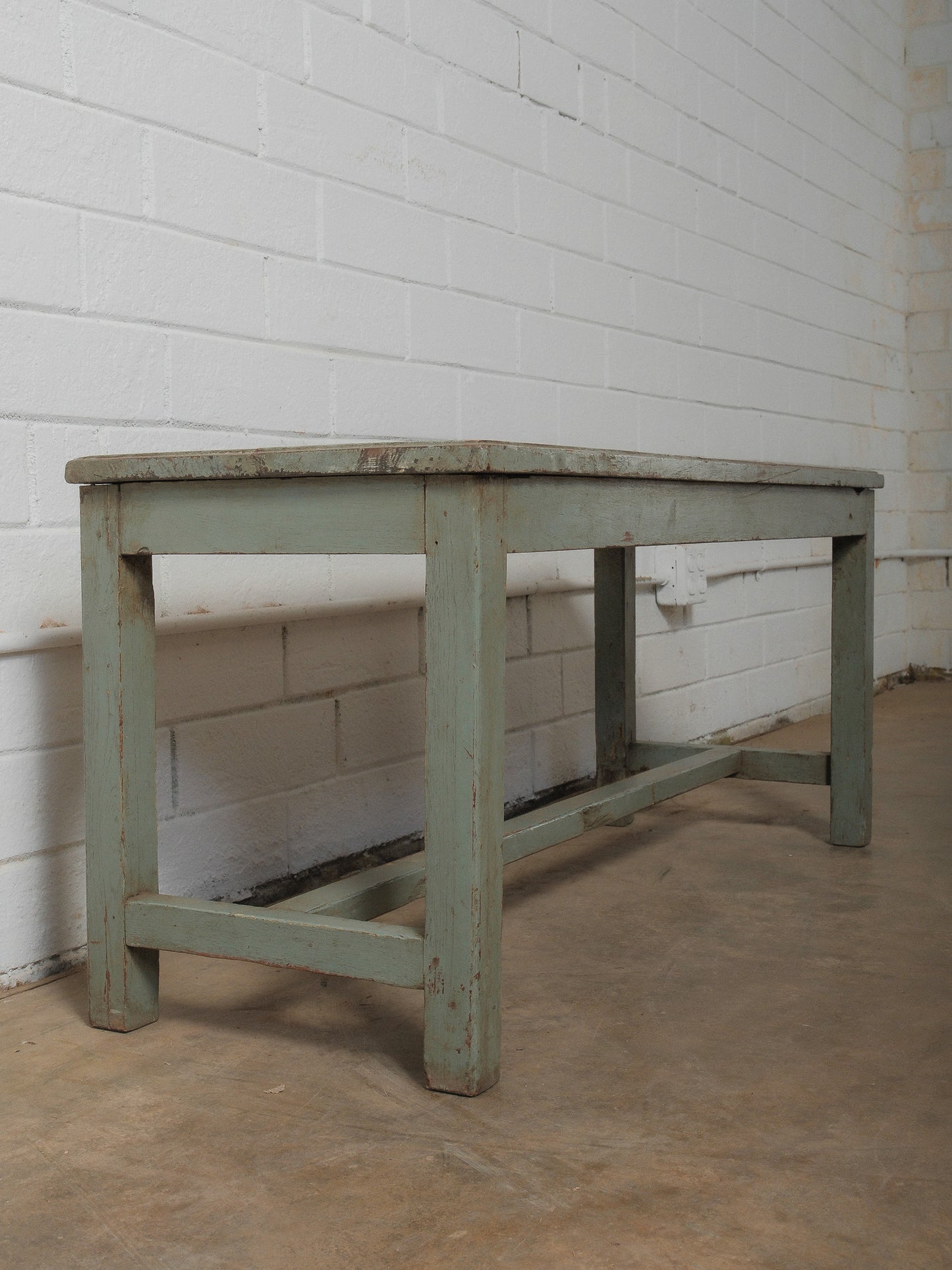 Distressed Green Wooden Bench with Weathered Patina