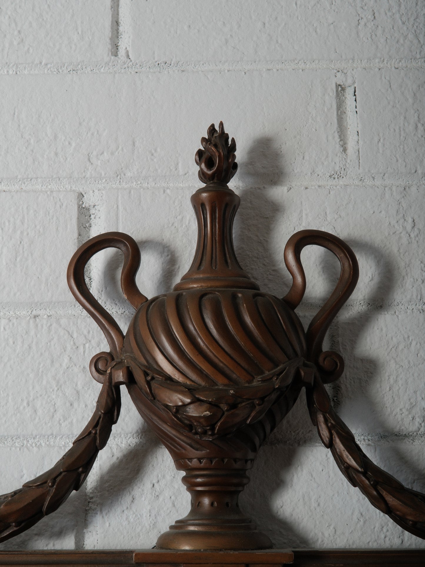 Carved Wood Mirror with Classical Urn Crest and Applied Metal Ornamentation