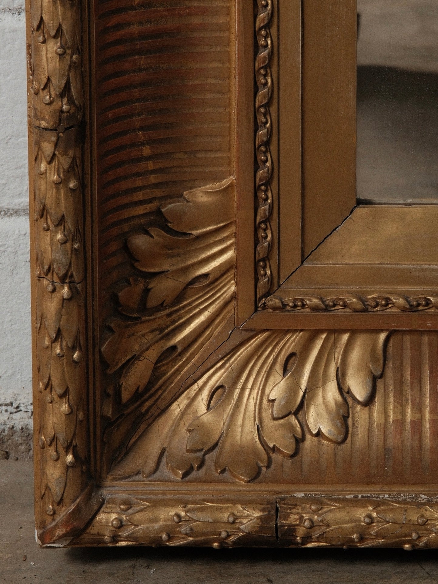 Late 19th Century European Hand-Carved Wooden Mirror with Ornate Foliate Frame