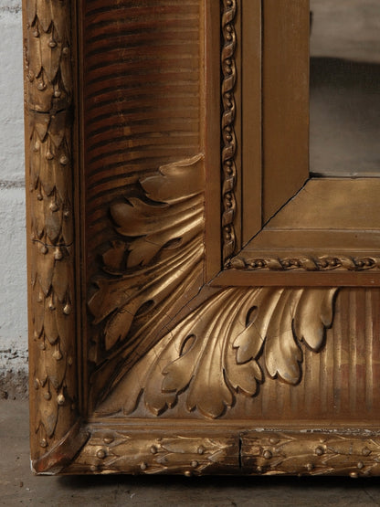 Late 19th Century European Hand-Carved Wooden Mirror with Ornate Foliate Frame