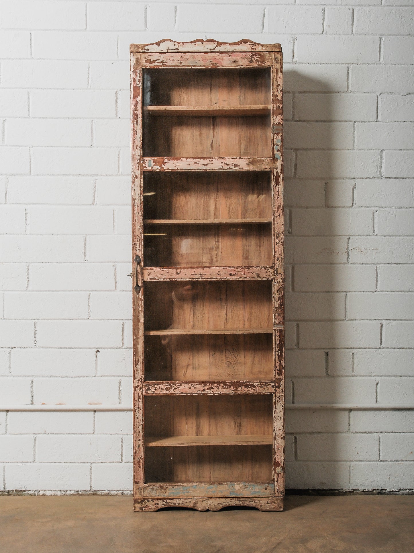 Tall Narrow Distressed Wooden Glass Front Showcase Cabinet with Original Patina