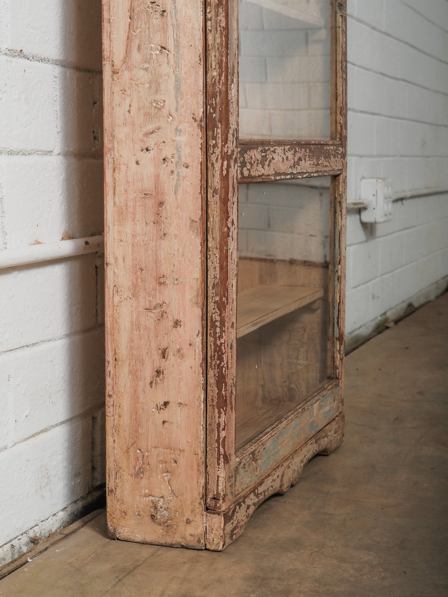 Tall Narrow Distressed Wooden Glass Front Showcase Cabinet with Original Patina