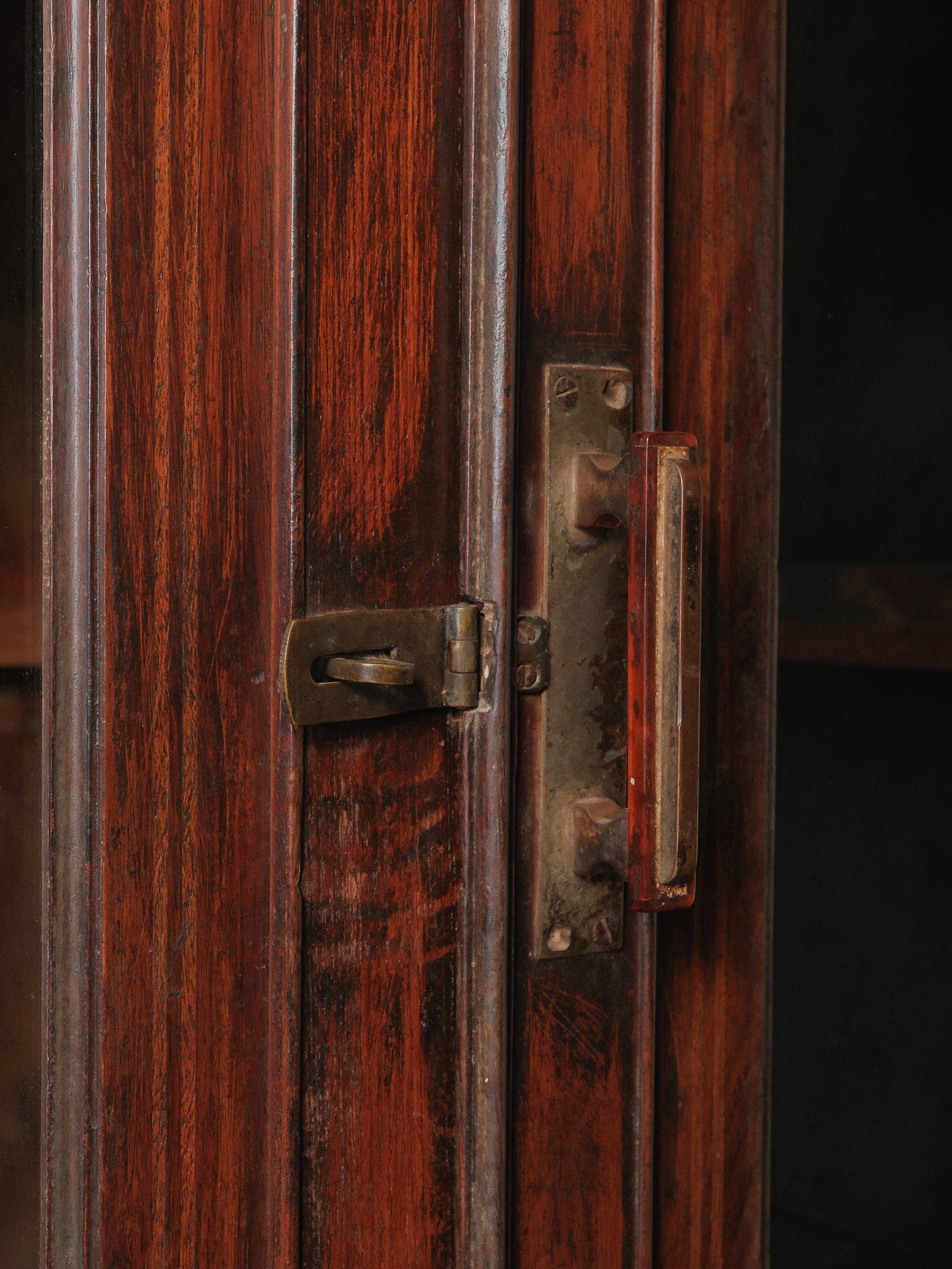 Large Two-Part Wooden Glass-Front Cabinet with Paneled Base and Carved Detail