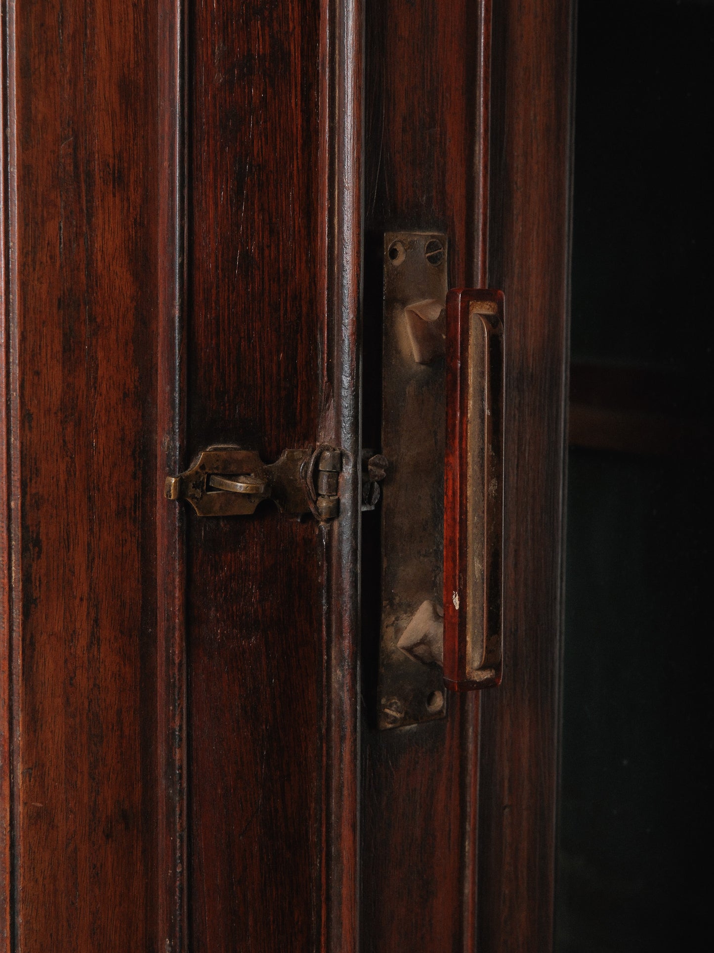 Large Two-Part Wooden Glass-Front Cabinet with Paneled Base and Carved Detail