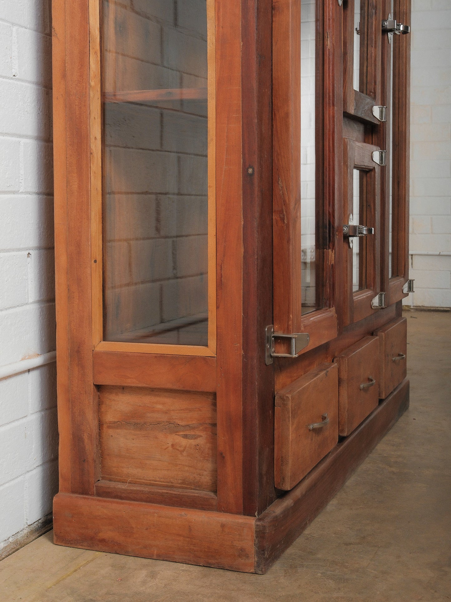 Wooden Glass-Front Cabinet with Dual-Sided Doors and Drawers