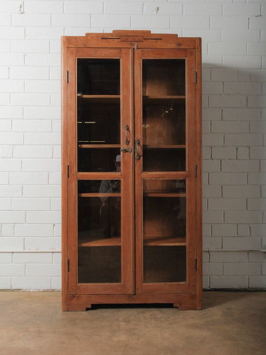 Tall Wooden Glass-Front Display Cabinet with Paneled Sides and Brass Hardware