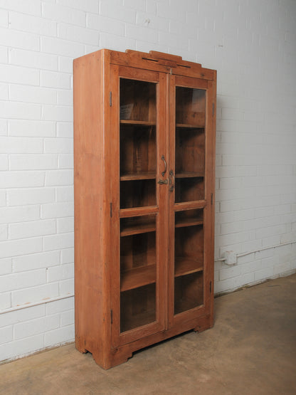 Tall Wooden Glass-Front Display Cabinet with Paneled Sides and Brass Hardware