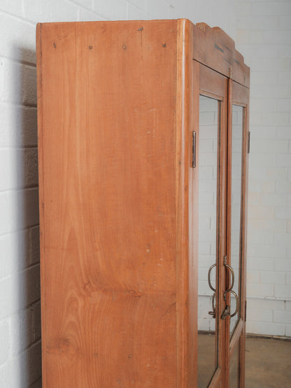 Tall Wooden Glass-Front Display Cabinet with Paneled Sides and Brass Hardware