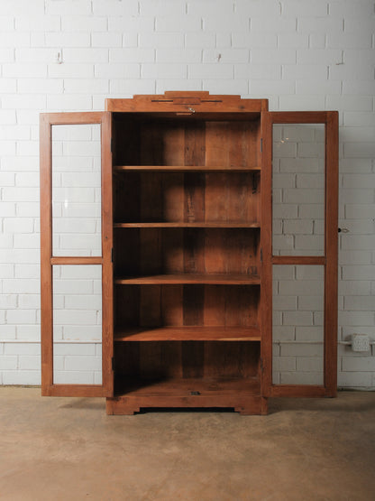 Tall Wooden Glass-Front Display Cabinet with Paneled Sides and Brass Hardware