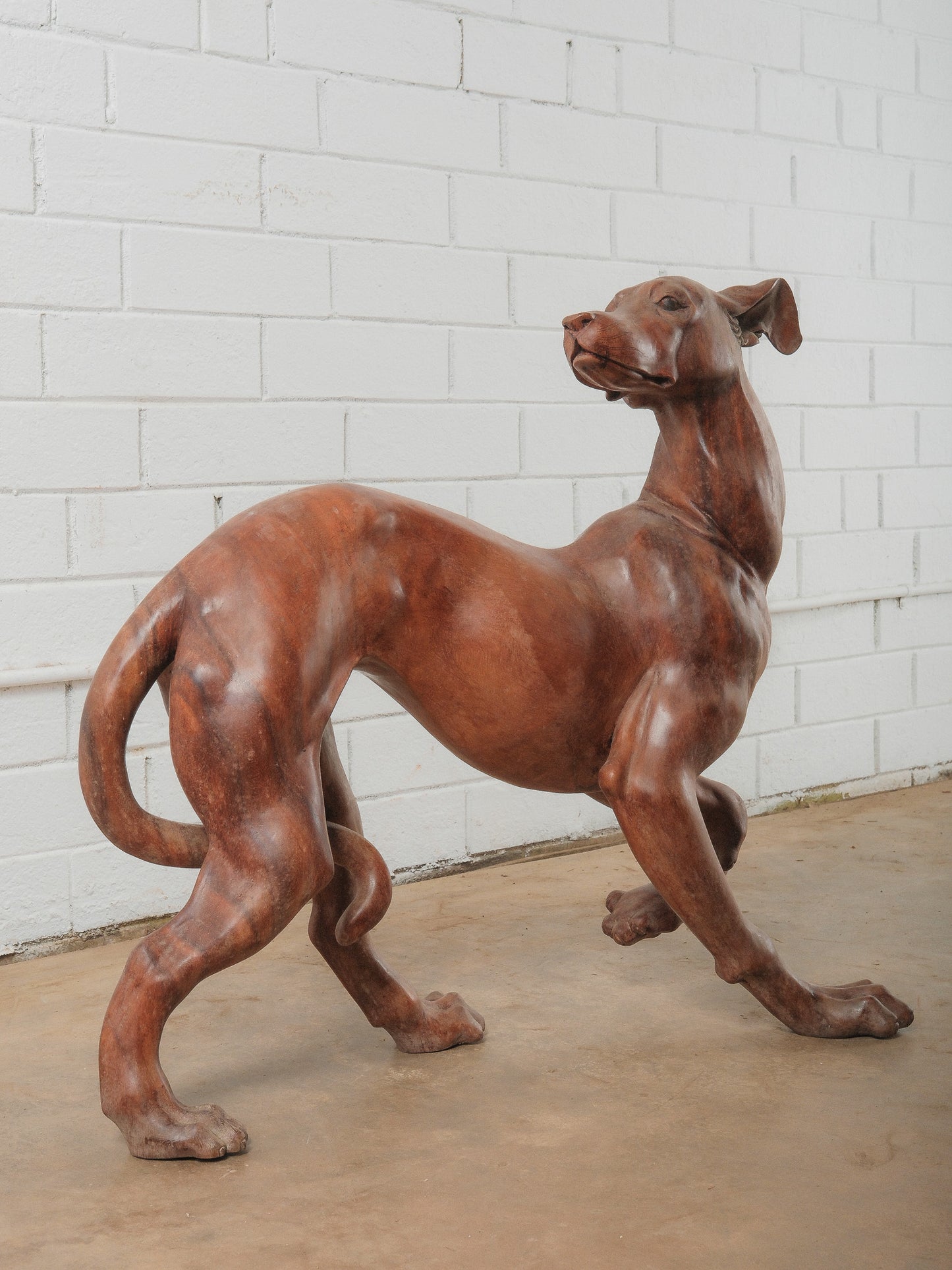 Hand-Carved Wooden Dog Sculpture in Dynamic Running Pose
