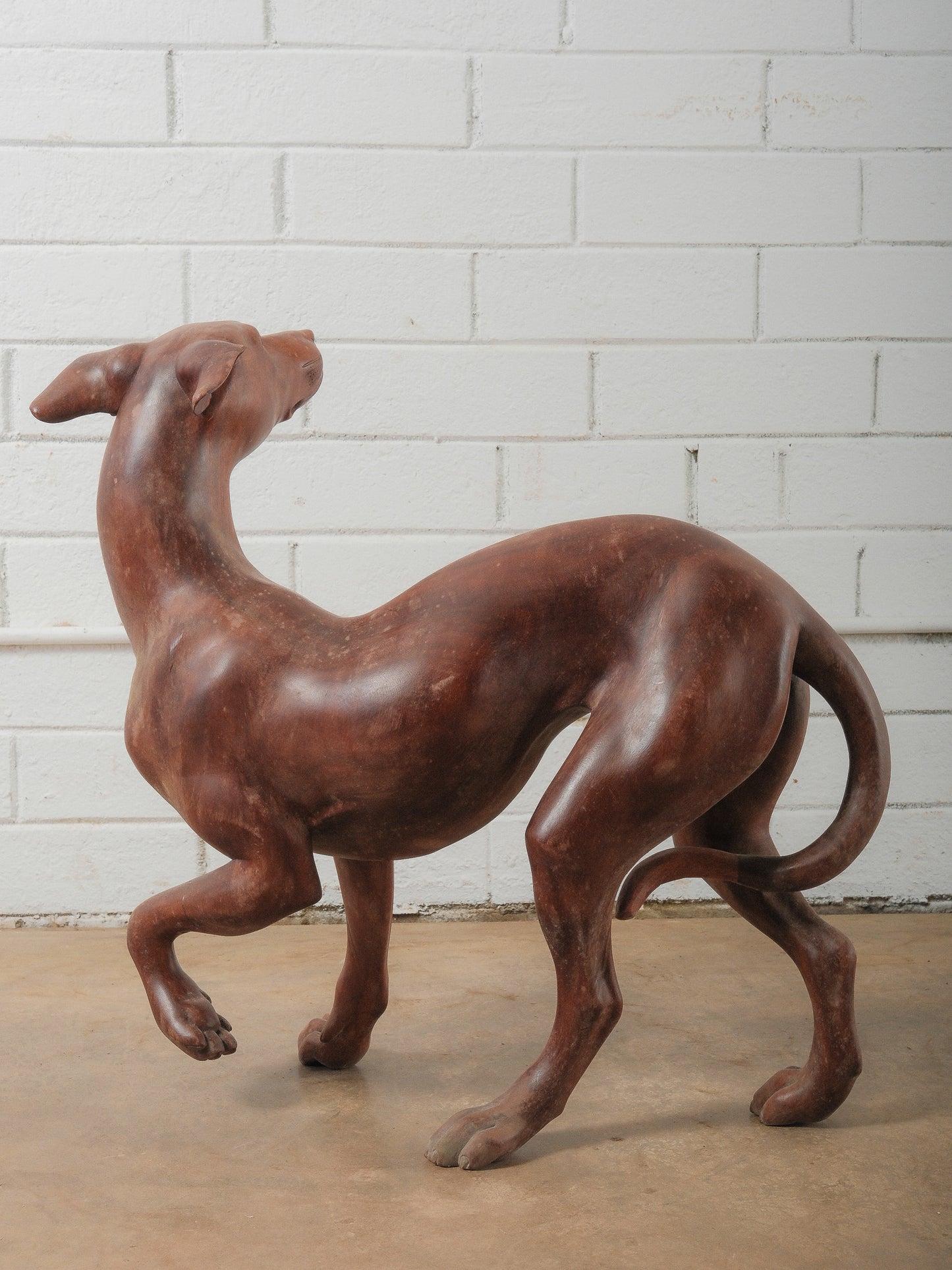 Hand-Carved Wooden Greyhound Sculpture in Expressive Mid-Stride Pose