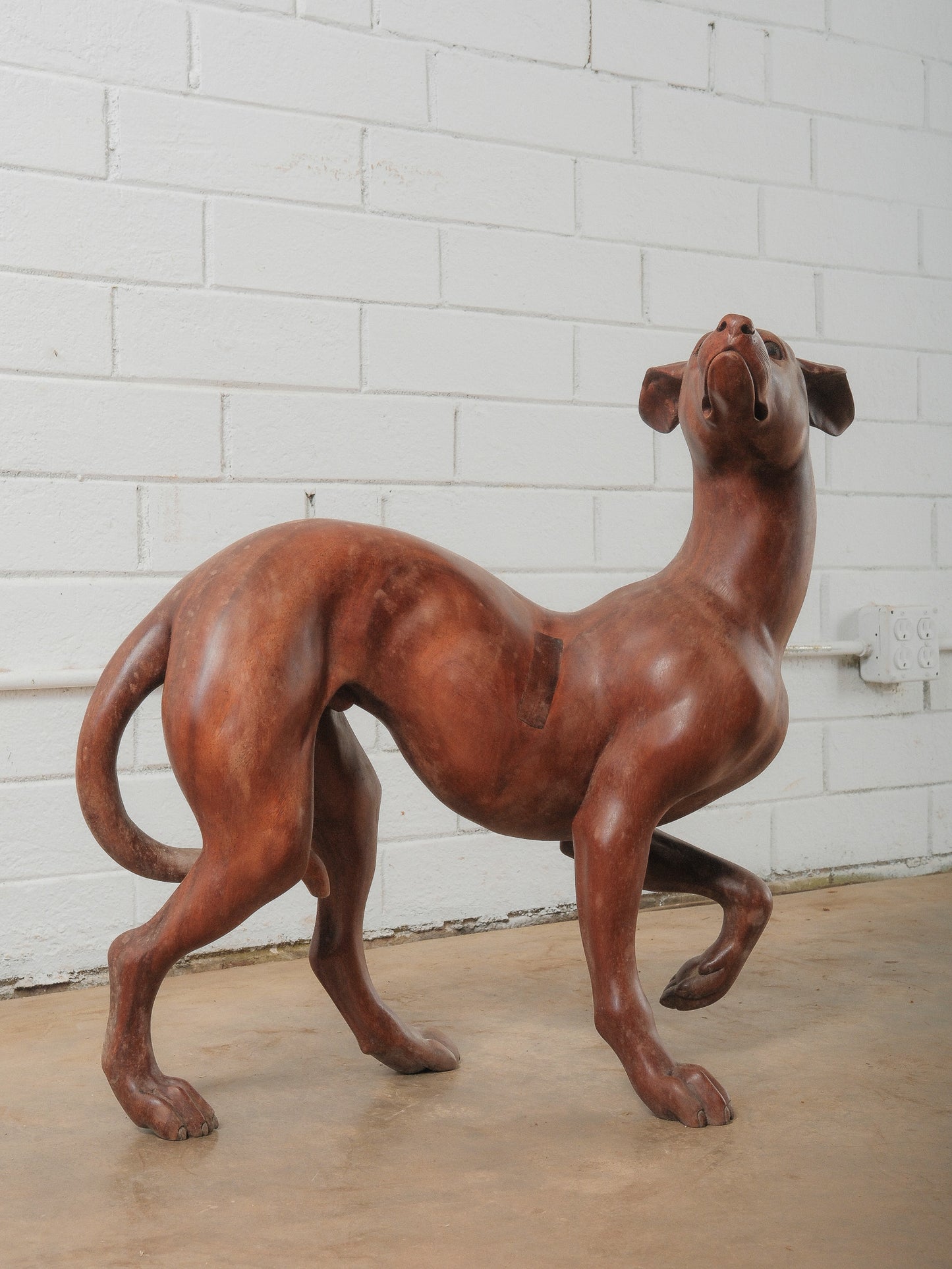Hand-Carved Wooden Greyhound Sculpture in Expressive Mid-Stride Pose
