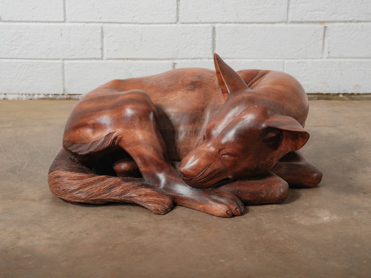 Hand-Carved Wooden Sleeping Dog Sculpture in Curled Resting Pose