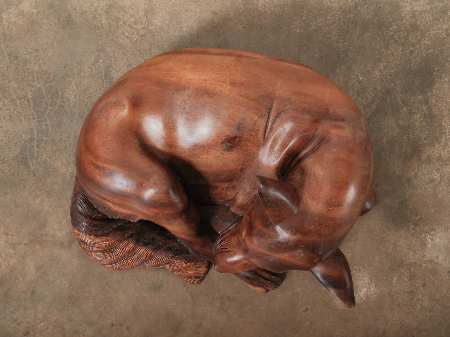 Hand-Carved Wooden Sleeping Dog Sculpture in Curled Resting Pose
