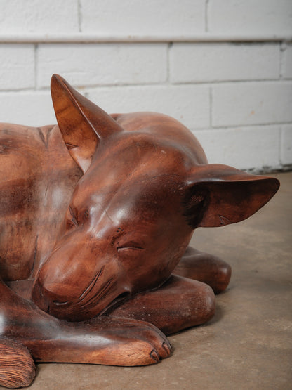 Hand-Carved Wooden Sleeping Dog Sculpture in Curled Resting Pose