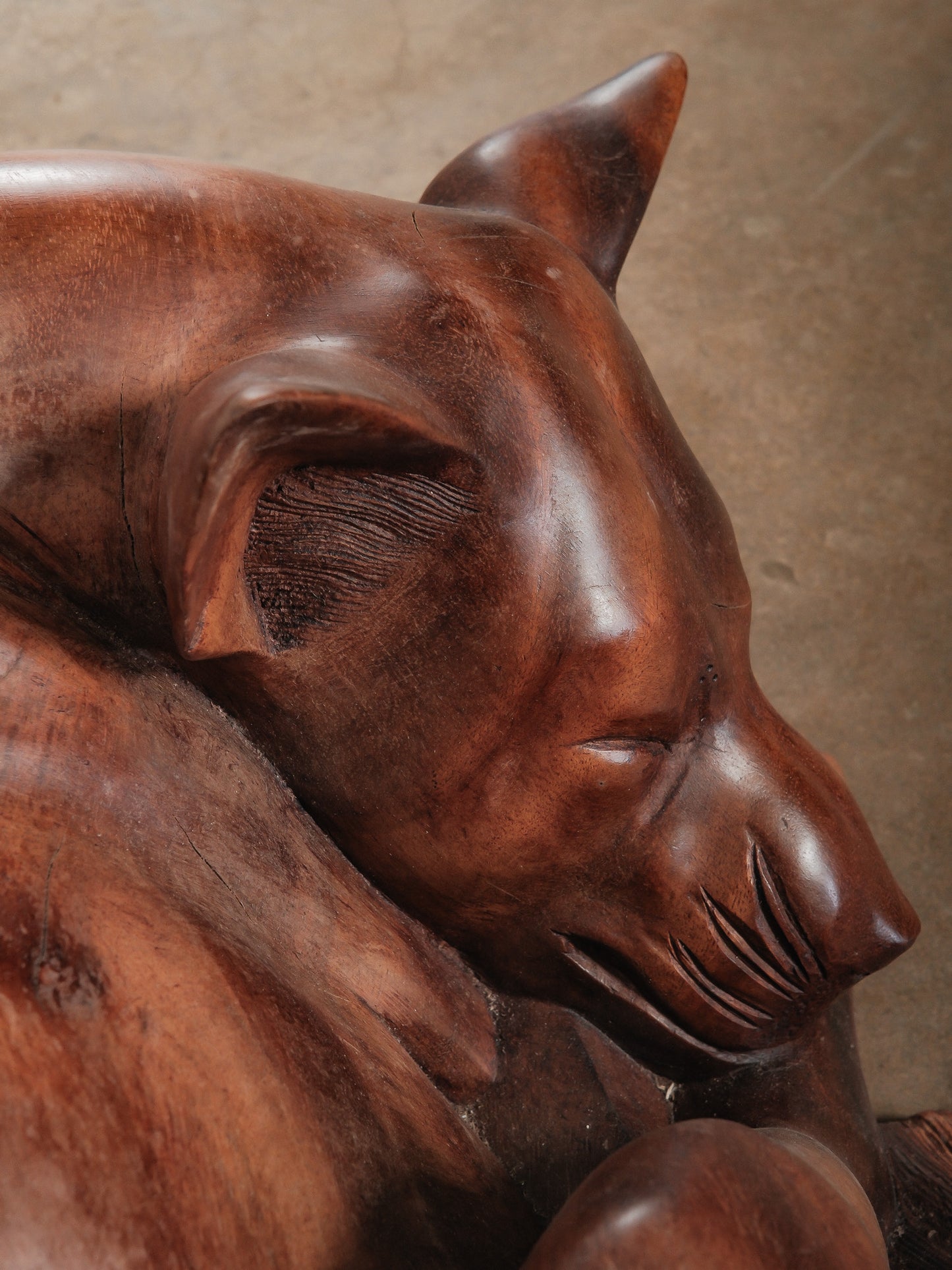 Hand-Carved Wooden Sleeping Dog Sculpture in Curled Resting Pose