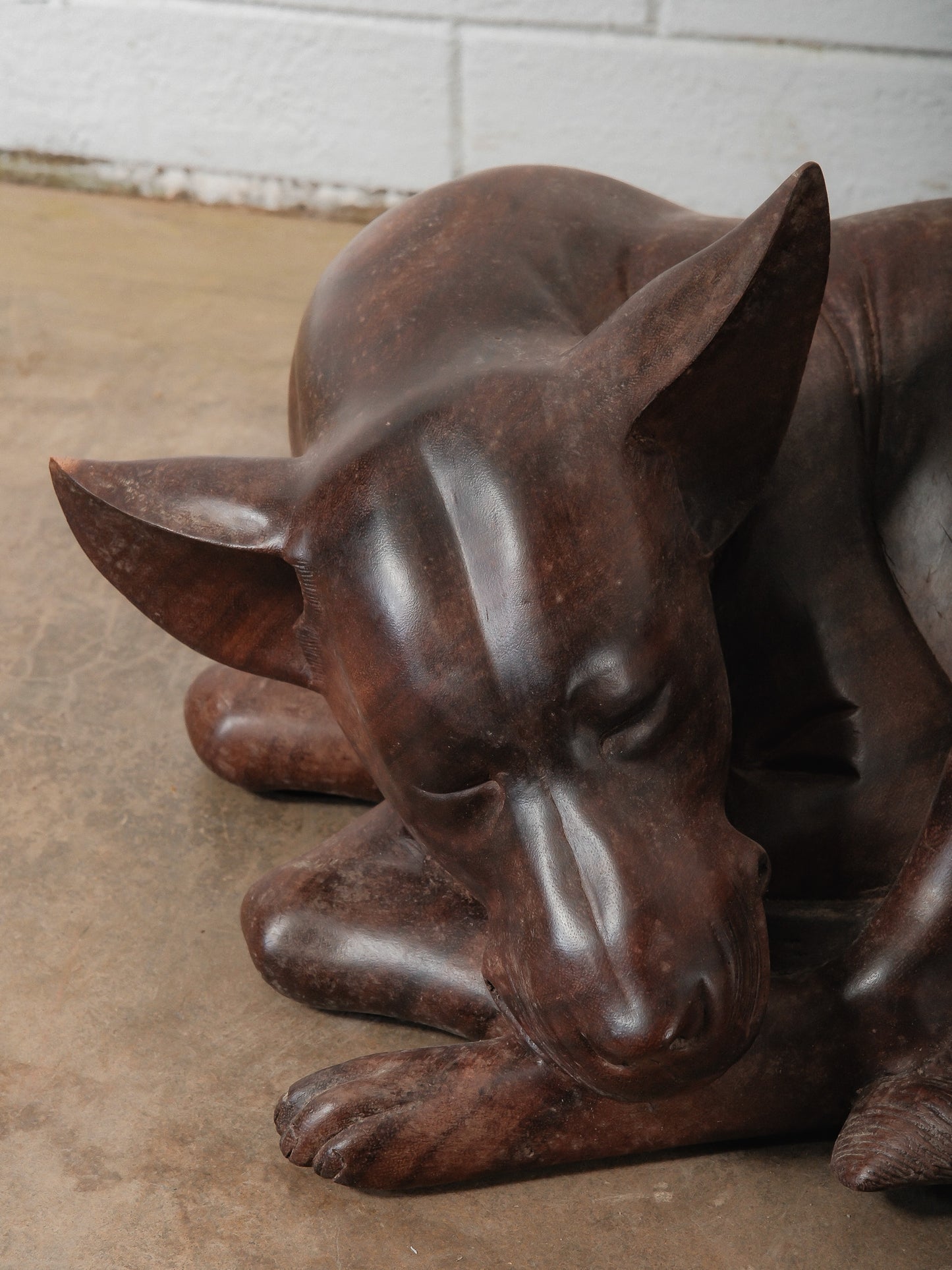 Hand-Carved Wooden Sleeping Dog Sculpture in Curled Resting Form
