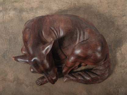 Hand-Carved Wooden Sleeping Dog Sculpture in Curled Resting Form