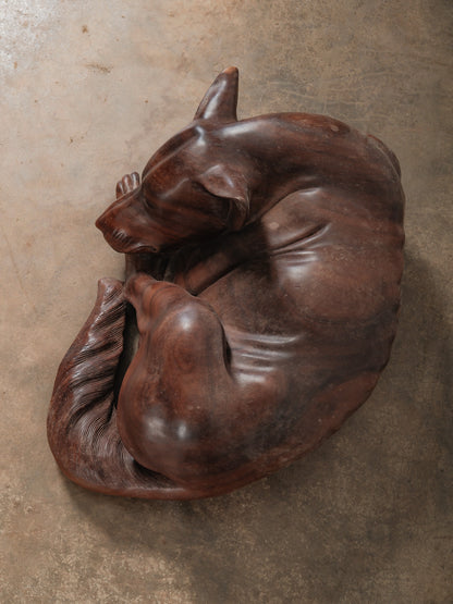 Hand-Carved Wooden Sleeping Dog Sculpture in Curled Resting Form