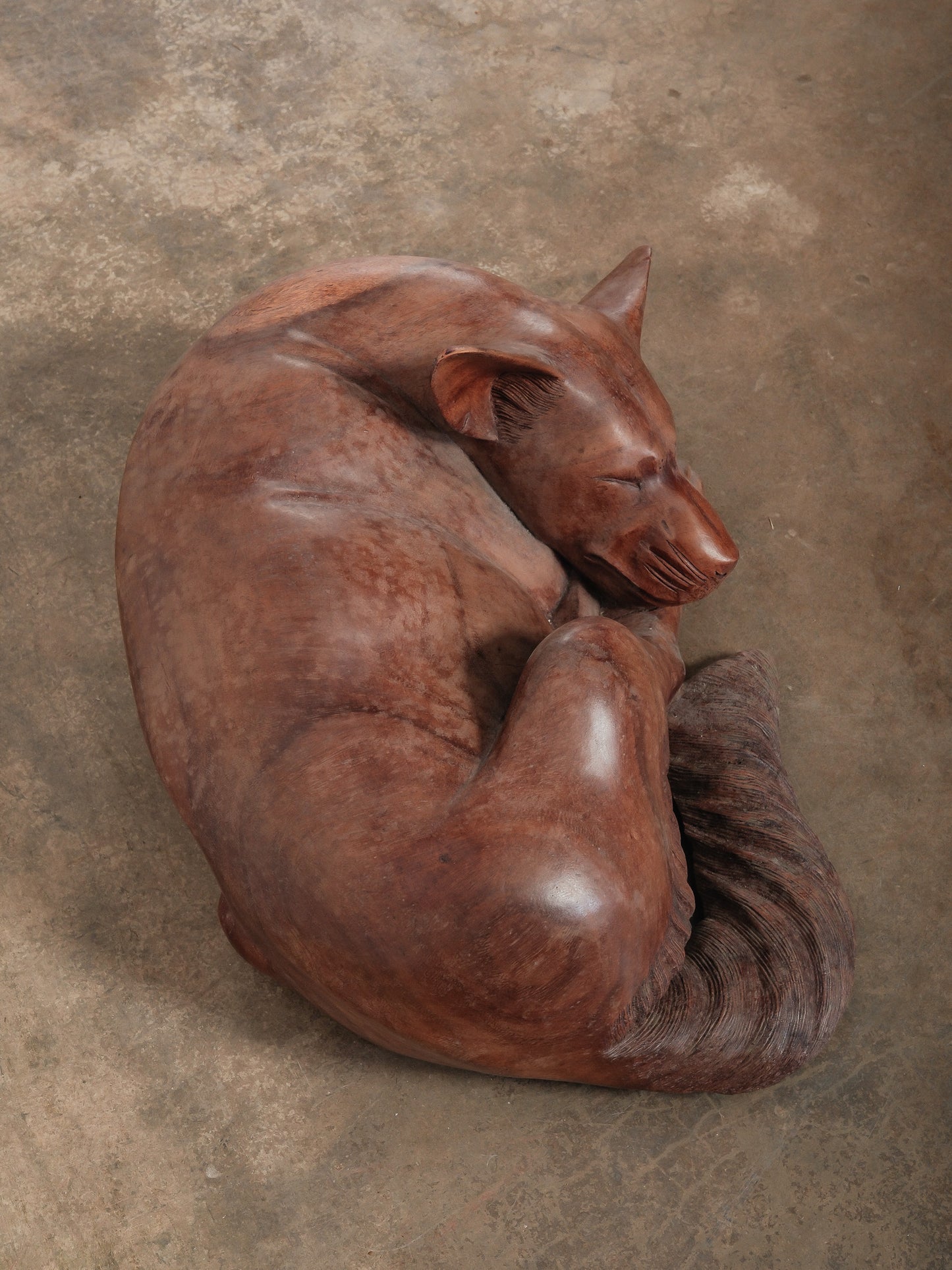 Hand-Carved Wooden Sleeping Dog Sculpture in Curled Form