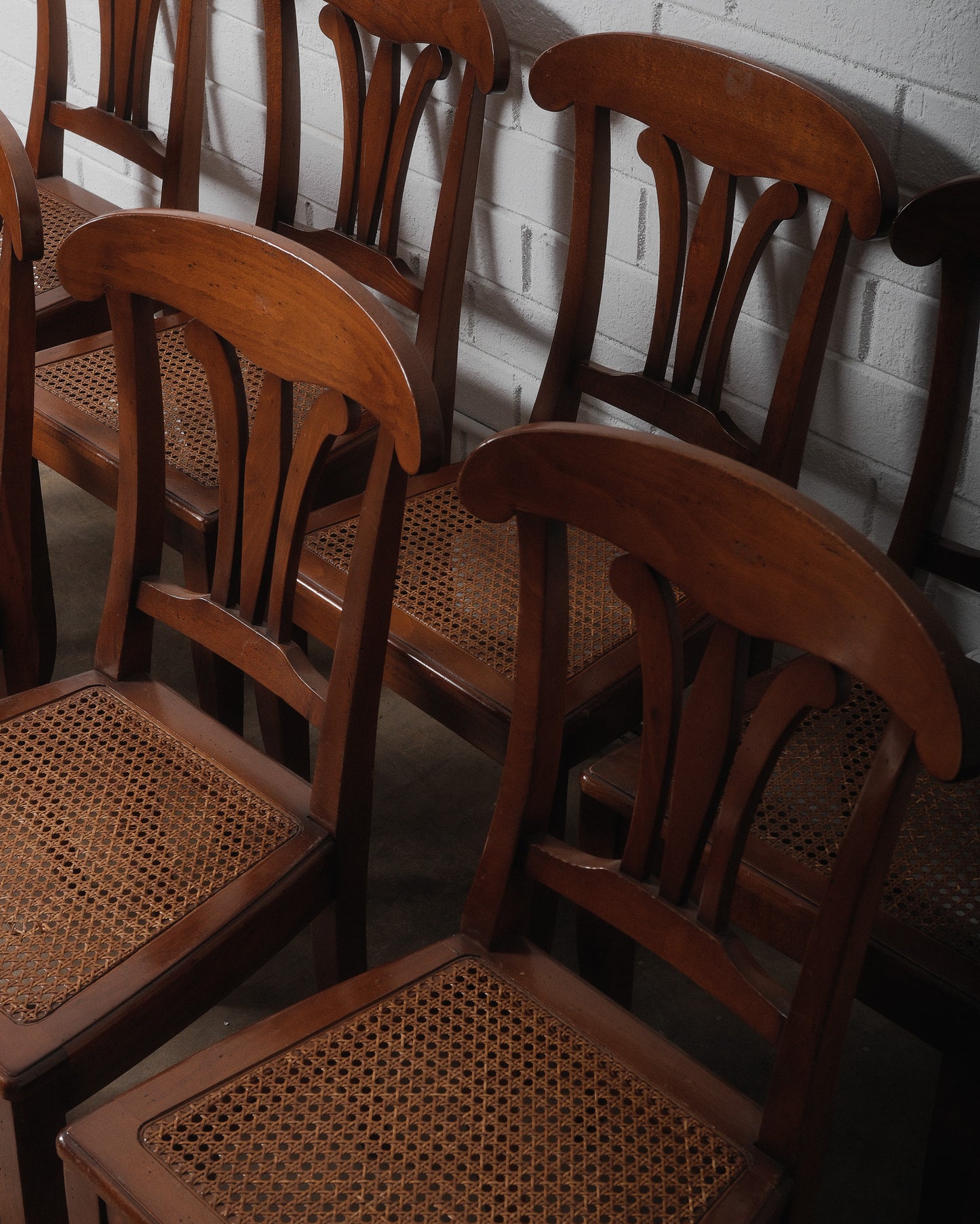Set of Eight Vintage Wooden Dining Chairs with Curved Backs and Woven Cane Seats