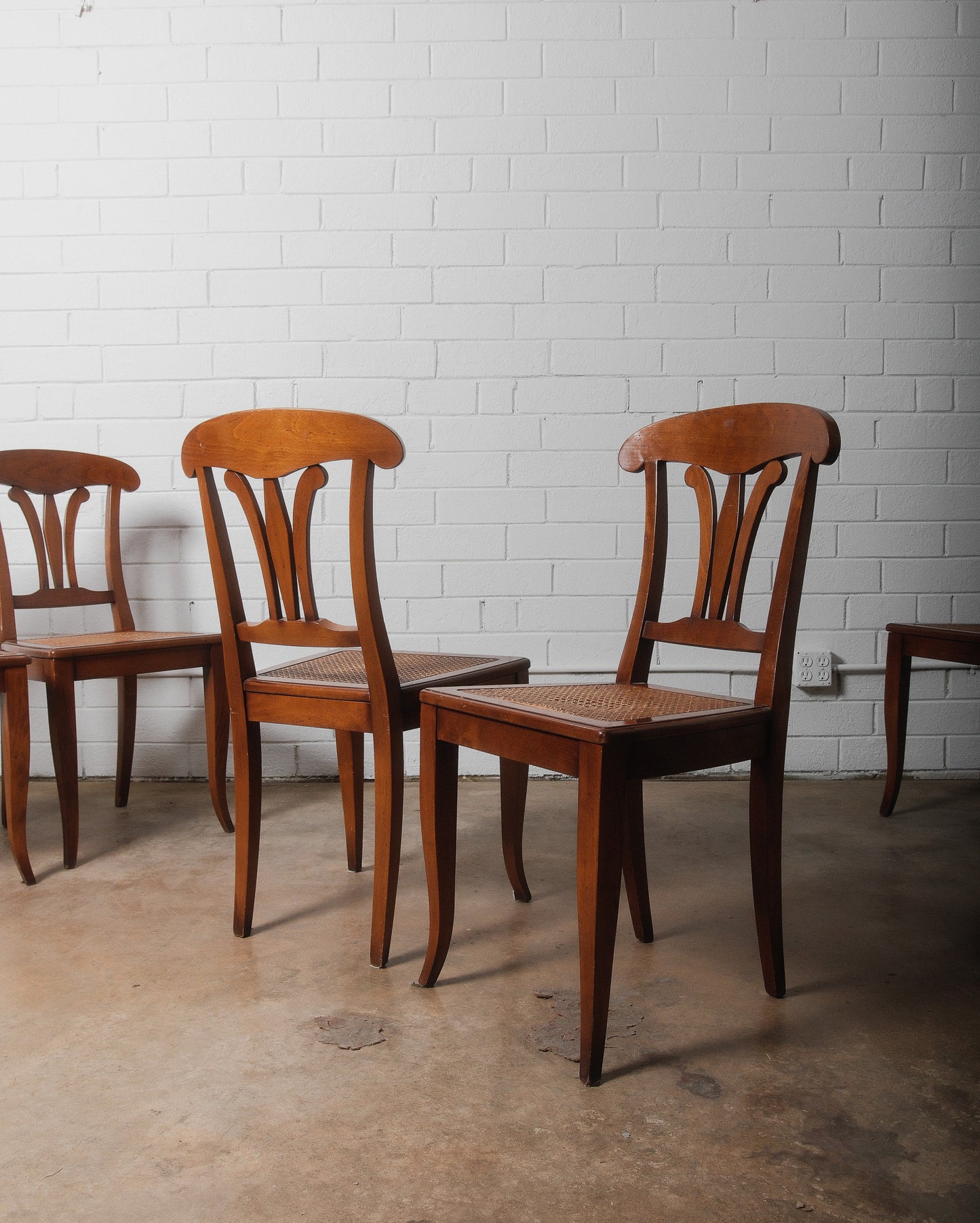 Set of Eight Vintage Wooden Dining Chairs with Curved Backs and Woven Cane Seats