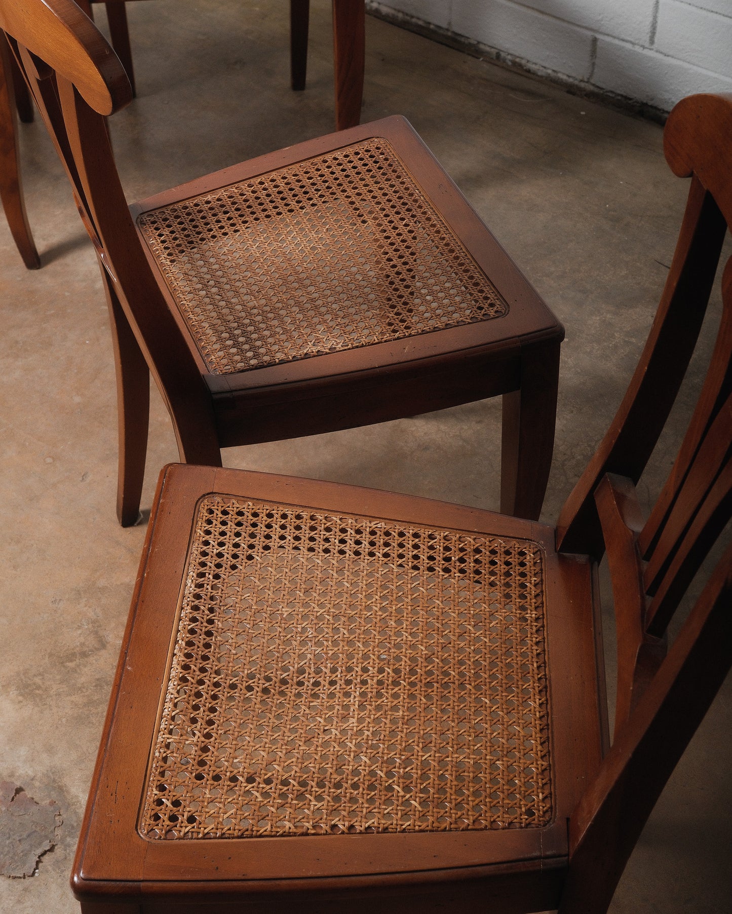 Set of Eight Vintage Wooden Dining Chairs with Curved Backs and Woven Cane Seats